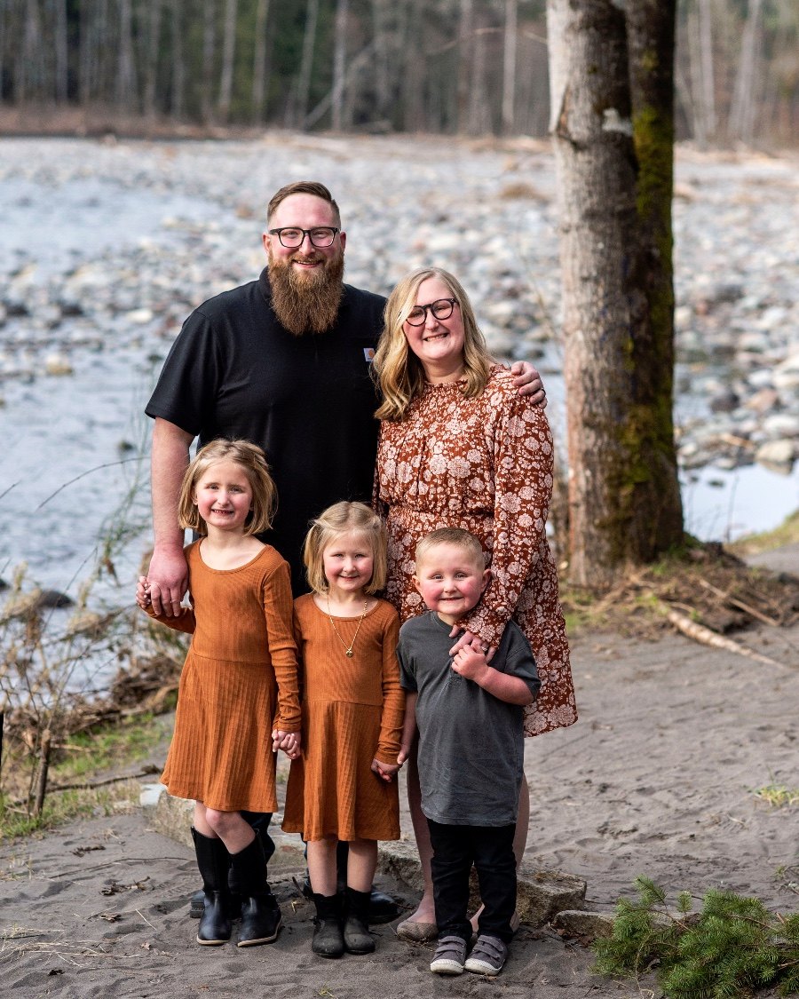Nate, Taylor, and the kids by a rocky riverbank